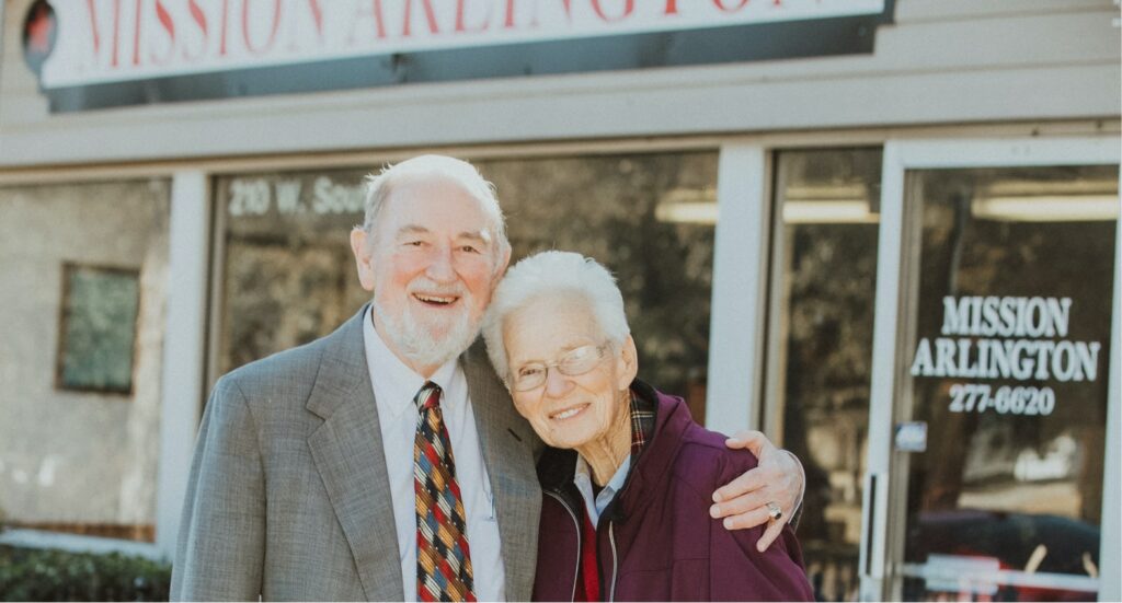 couple in front of storefront